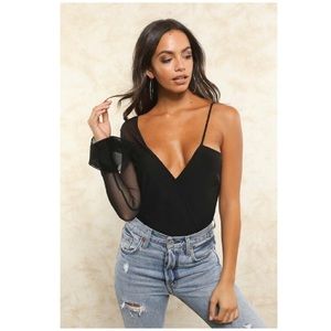 Shop Fletch body suit. Brand new